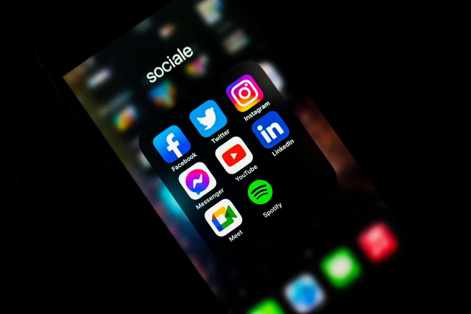 Smartphone displaying social media apps representing digital brand presence